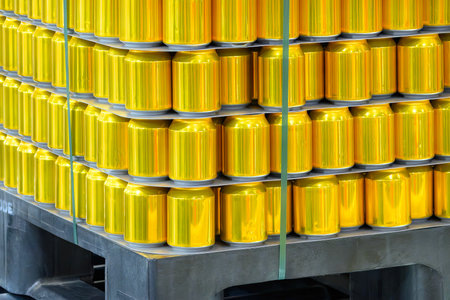 The pallet of gold aluminum cans. The can drinking  delivery process at the warehouse.の写真素材