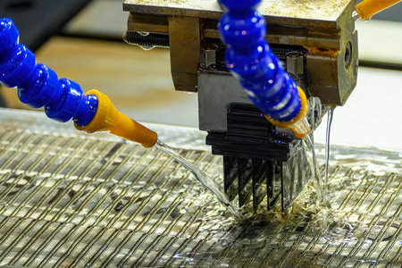 The graphite electrode working on EDM machine with liquid coolant method. The mold and die...