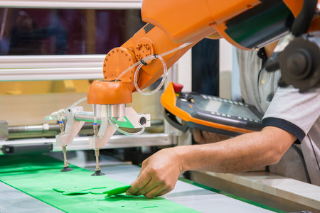 The material handling process by robotic arm. The automatic material handling the rubber sheet parts...