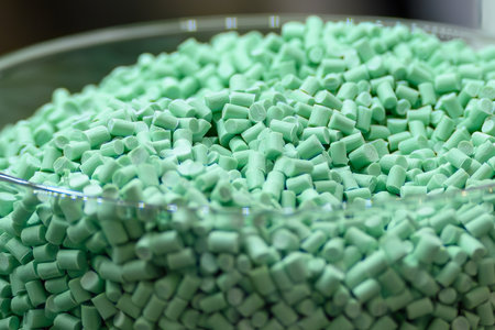 Close up scene the green pigment material for injection process. The raw material of plastic...