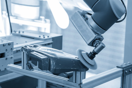 The automotive parts polishing process by robotic system in the light blue scene. The high technology car painting process by automatic system.の写真素材