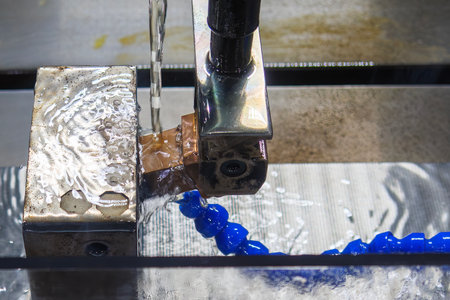 The operation of side spark EDM machine with copper electrode. The mold and die manufacturing...