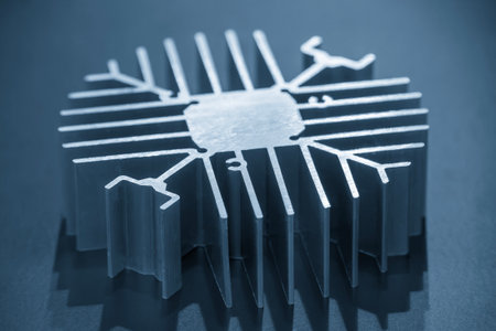 The circular shape aluminum heat sink profile in the light blue scene. Close up scene the profile extrusion manufacturing concept.の写真素材