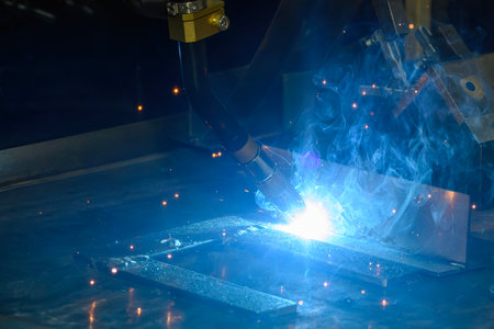Close up scene the laser welding process by robotic system. The high technology welding process by...
