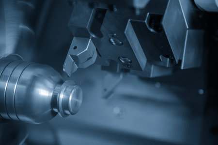 The CNC lathe machine groove cutting the metal mold parts in the light blue scene. The high...