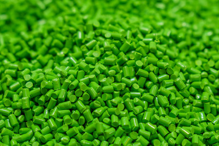 The pile of green pellets materials for  injection process. The raw material from petrochemical...