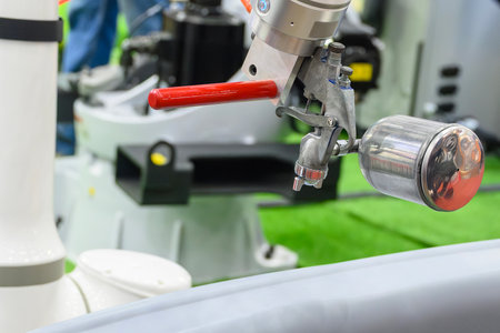 Close up scene the spray painting robot working with automotive parts. The high technology painting in the automotive factory.の写真素材