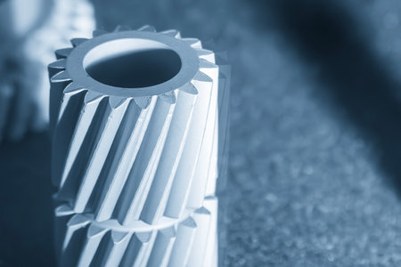 Close up scene small gear shape part from laser sintering method in the blue tone scene. The additive manufacturing process by rapid prototype method.の写真素材