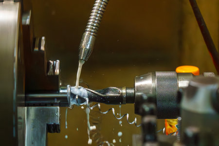 The hole drilling process on turning machine with liquid coolant method. The metal working  process...