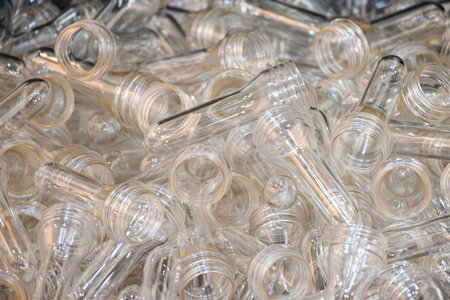 Close up scene of group of preform shape of PET bottle products. The raw material for plastic bottle manufacturing process.の写真素材