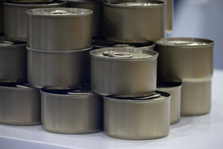 Close up scene the piles of tinned can food. The high technology material handling process in canned food production by conveyer belt.の写真素材