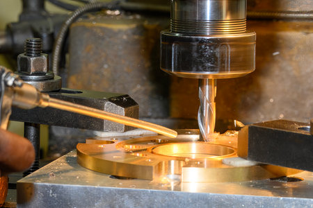 The hole boring  process on NC milling machine by flat nose end mill tool with brass ring parts. The...