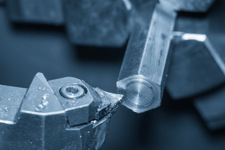 Close up scene the lathe machine finish cut metal shaft parts in blue scene. The metalworking...