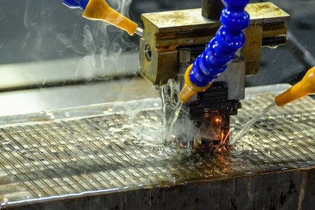 The mold production process by EDM machine working with graphite electrode. The mold and die...