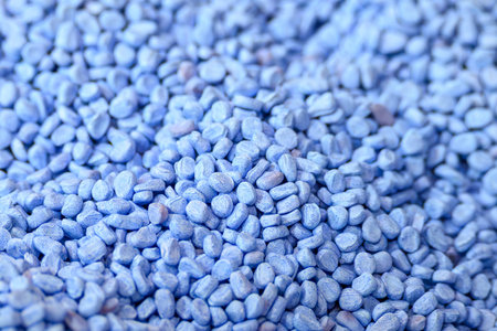 The concentrated pile of virgin polymer granules, specifically formulated as feedstock for...