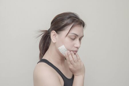 Women Teeth, jaw pain and sticking plaster.の写真素材