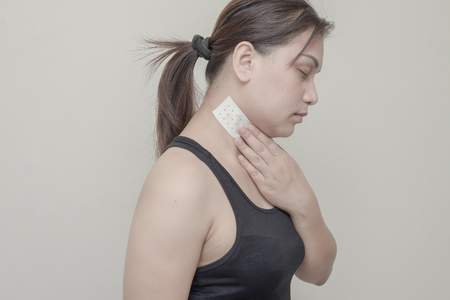 Women neck pain and sticking plaster.の写真素材