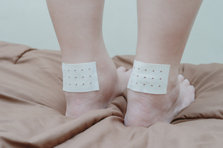 Women Ankle ligament pain and sticking plaster.の写真素材
