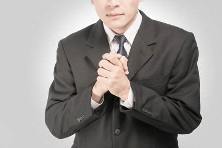 Asian business man on a gray background isolates.の写真素材