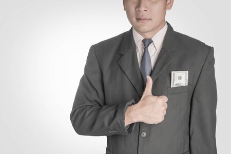 Asian businessmen Happy when he had a dollar.の写真素材