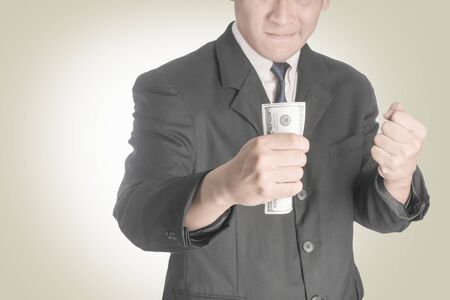 Asian businessmen Happy when he had a dollar.の写真素材