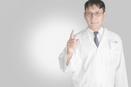 Asian Doctor on white. The concept of good health.の写真素材
