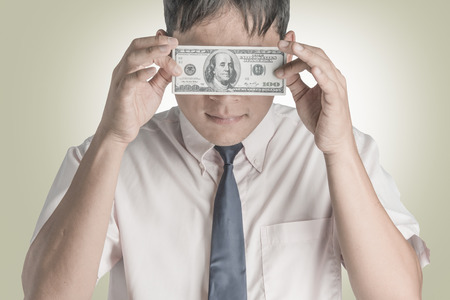 Asian businessmen Happy when he had a dollar.の写真素材