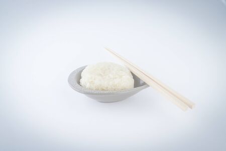 Asian foods sticky rice on the plate and chopsticks.の写真素材