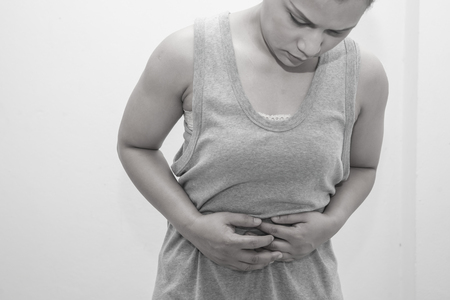 woman abdominal pain black and white picture.Conception of illnessの写真素材