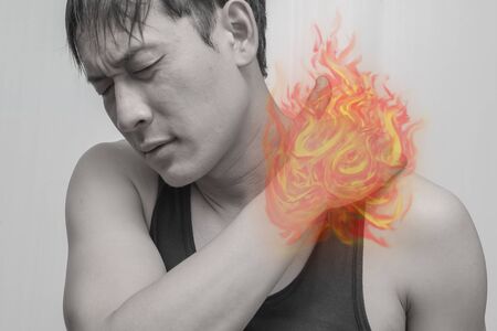 Spine, neck pain.Using fire as a symbol of painful and cancer.の写真素材