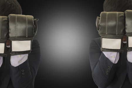 Businessmen put the boxing gloves.の写真素材