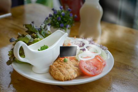 Fried Chicken and Vegetables and White Sauce,A sign with space for text.
Steam means freshness.の写真素材