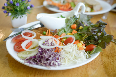 Vegetables and white sauce, served with fried foods.の写真素材