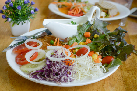 Vegetables and white sauce, served with fried foods.の写真素材