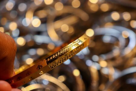 golden kada bracelet kept for selling outside golden temple in amritsarの写真素材