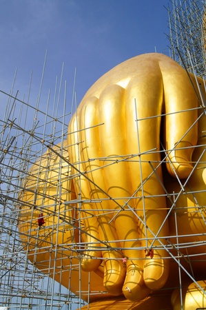 Hand of Golden Buddha Statue Under Constructionの写真素材
