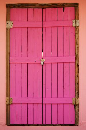 Wooden Pink Door Was Locked By The Combination Lock                      の写真素材