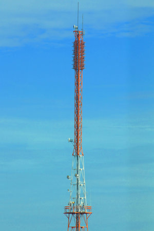 Tower of communications with antennas in the middle of skyの写真素材
