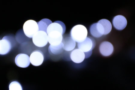 White Bokeh on black backgroundの写真素材