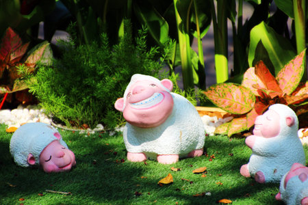 Family lambs statues  in the garden の写真素材
