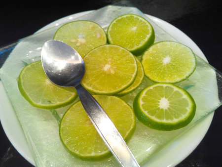 Lemon sheet on white discの写真素材