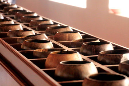 Monk's alms bowls in Thai templeの写真素材