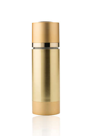 Gold color cosmetic bottle.