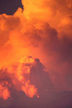 CUMULONIMBUS cloud in sunset background for forecast and meteorology conceptの写真素材
