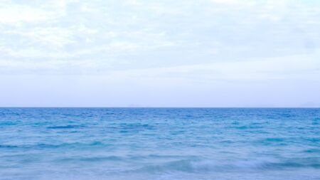 The balance of the sky and the calm blue seaの写真素材