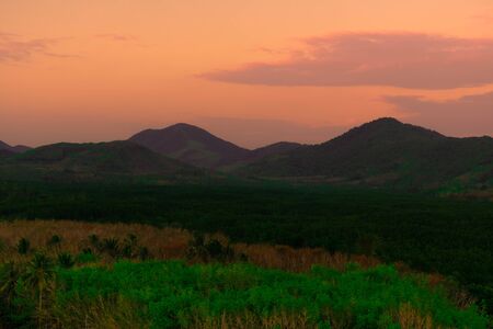 Bird eye view of scenery sunset over the  Tropical forest hills with toned dramatic colors,Koh yao...