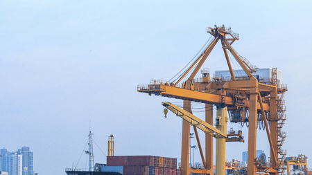 Close up Big crane Industrial Container yard for Logistic Import Export business with cloudy sky backgroundの写真素材