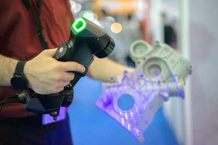 Reverse engineering concept: Engineer use 3d scanner scan work piece for tranfer to CAD file.