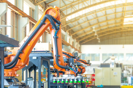 Factory 4.0 concept. Industrial robot in smart warehouse system for manufacture factory