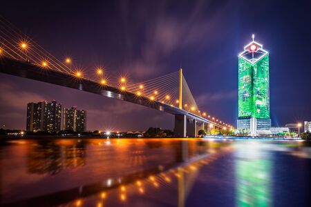 Rama IX Bridge on the Chao Phraya River at night in Bangkok, Thailandの写真素材